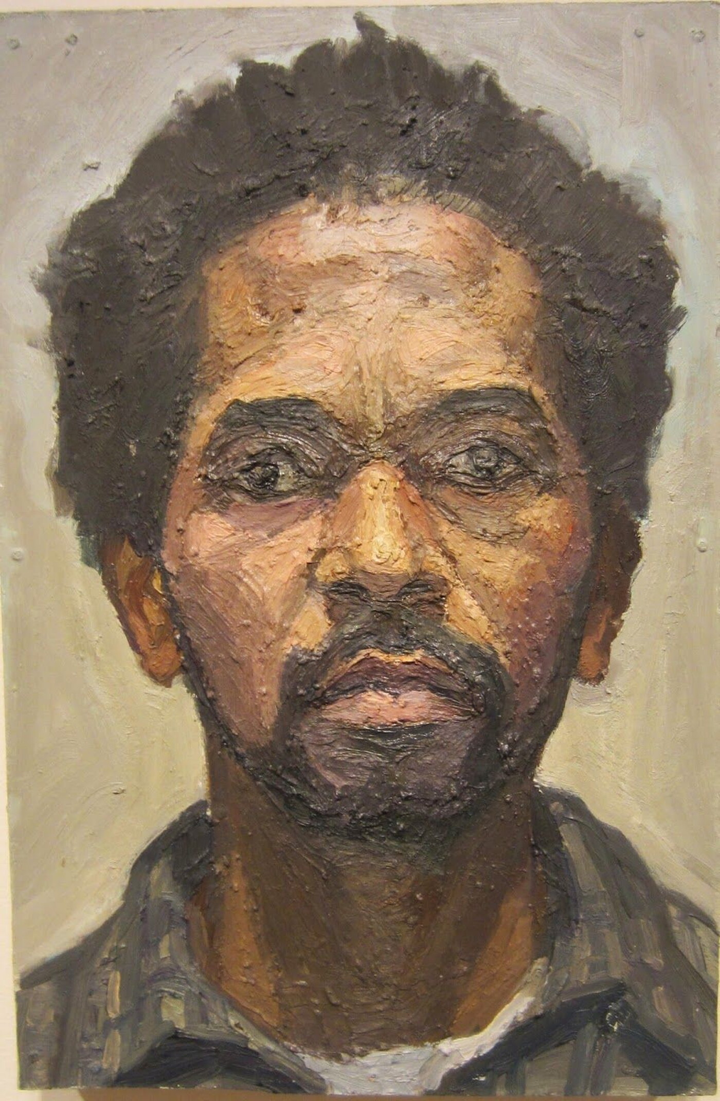 An oil painting of the head and shoulders of a Black man with short hair and a goatee.