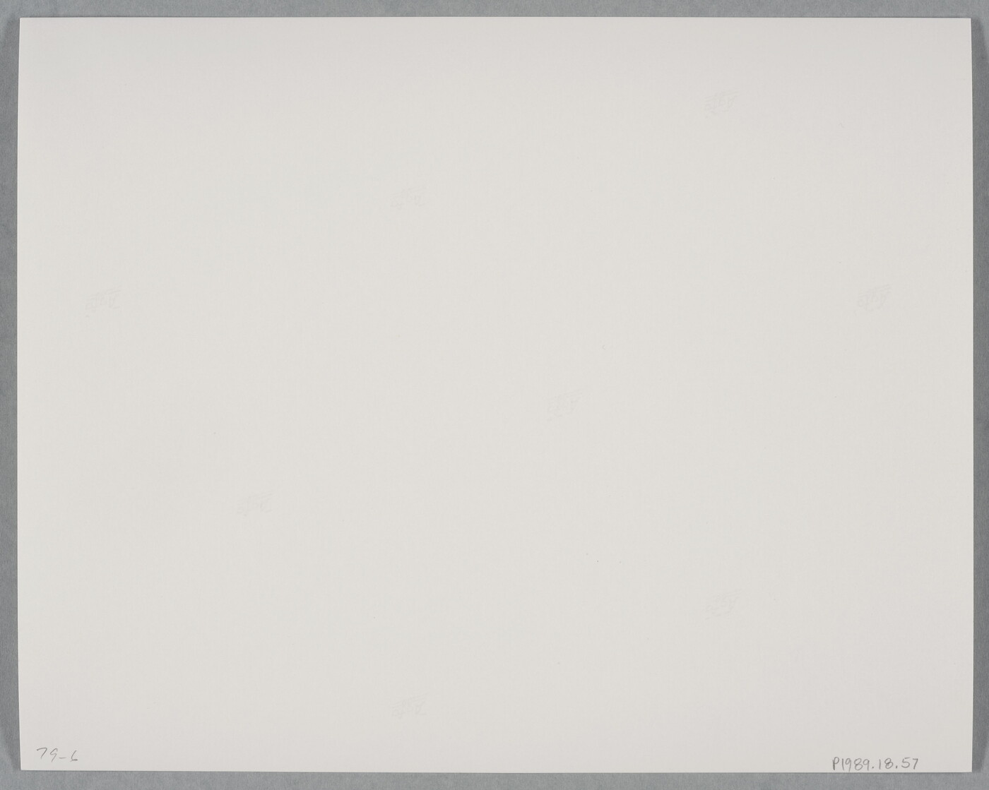 A black-and-white photograph of a mountainside that has been strip mined and the town below.