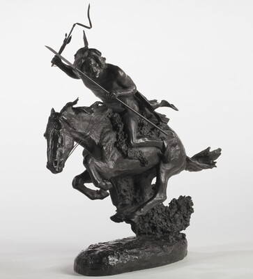 A bronze sculpture of an Indigenous person crouched on a running horse holding a spear and a whip.