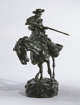 A bronze sculpture of a man on horseback pointing a long rifle.