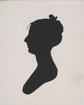 A silhouette of a woman in profile with her hair pulled into a bun, topped by a bow.