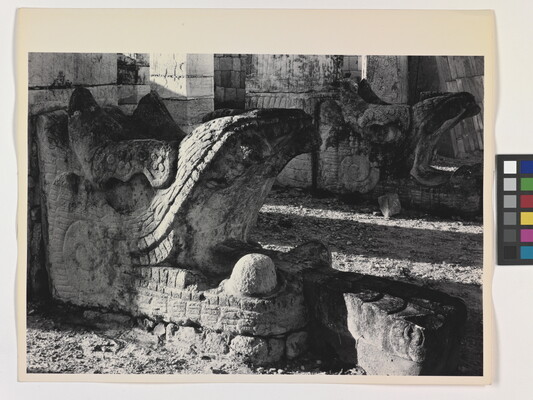 A black-and-white photograph of an ancient stone architectural embellishment in the form of an open-mouthed beast.
