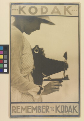 A sepia-toned advertisement poster for Kodak of a White woman in profile holding a large camera and looking down into the viewfinder.
