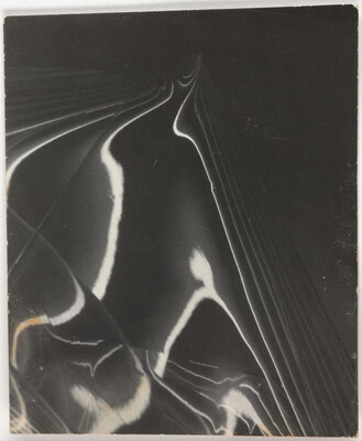 An abstract back-and-white photograph showing bands of light and shadow receding on a mirrored surface.