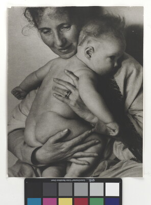 A black-and-white photograph of a White woman holding a naked baby to her chest.