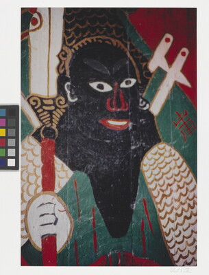 A color photograph of a mural featuring an abstract figure with curly hair and black skin, holding a decorative scepter.