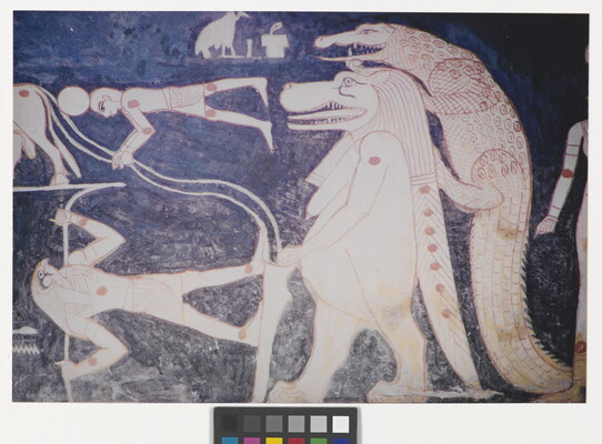 A color photograph of a mural with white and red hieroglyphs featuring several Egyptian gods, people, and what looks like a lion walking upright with a crocodile climbing on its back.