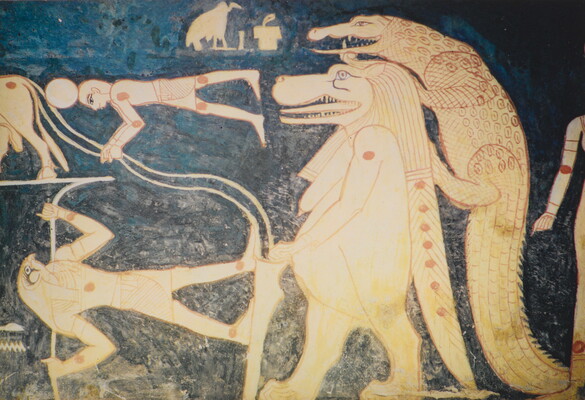 A color photograph of a mural with white and red hieroglyphs featuring several Egyptian gods, people, and what looks like a lion walking upright with a crocodile climbing on its back.