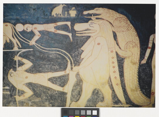 A color photograph of a mural with white and red hieroglyphs featuring several Egyptian gods, people, and what looks like a lion walking upright with a crocodile climbing on its back.