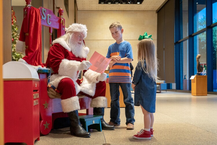 Two kids with Santa