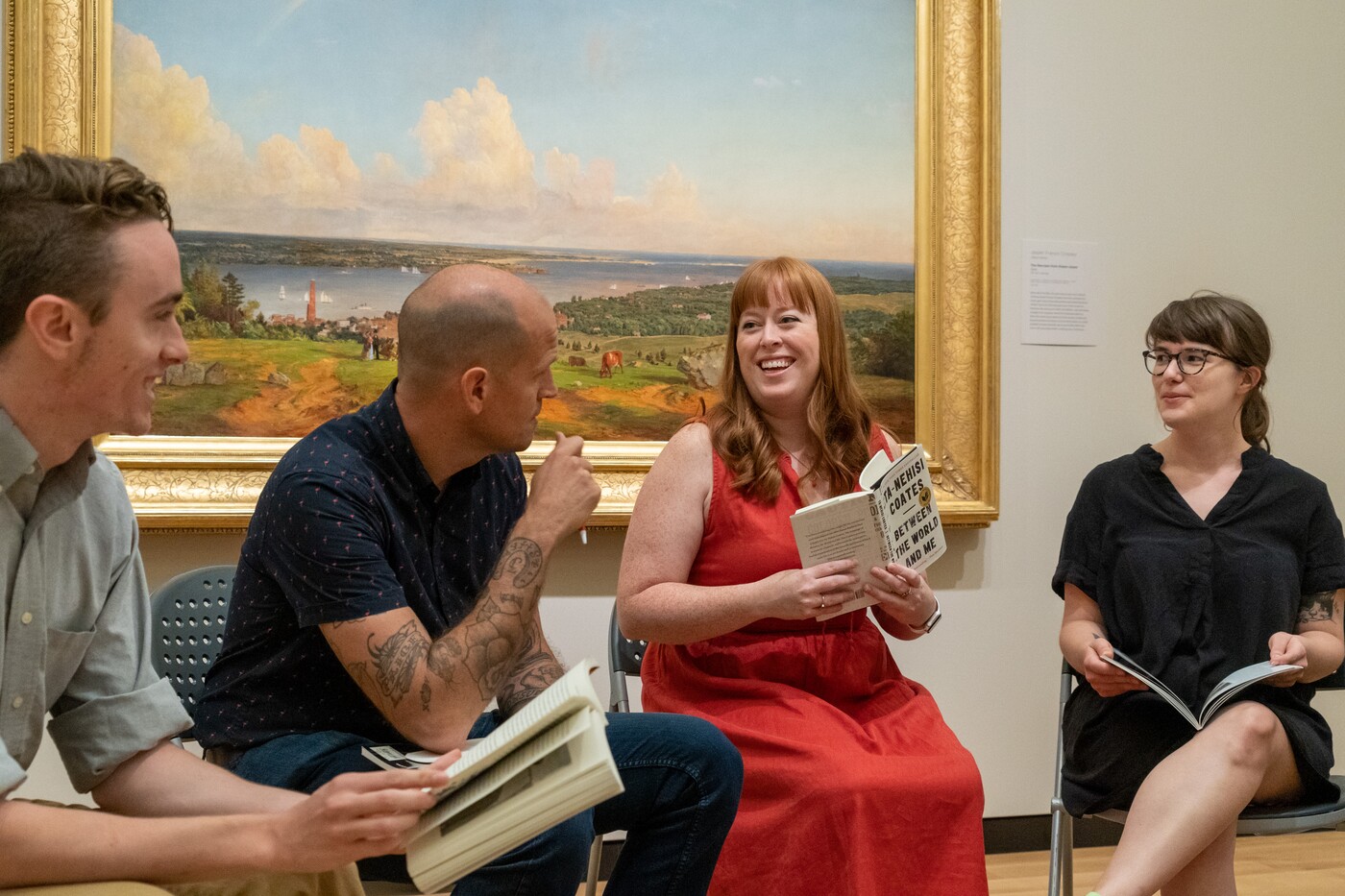 book club reading in an art gallery