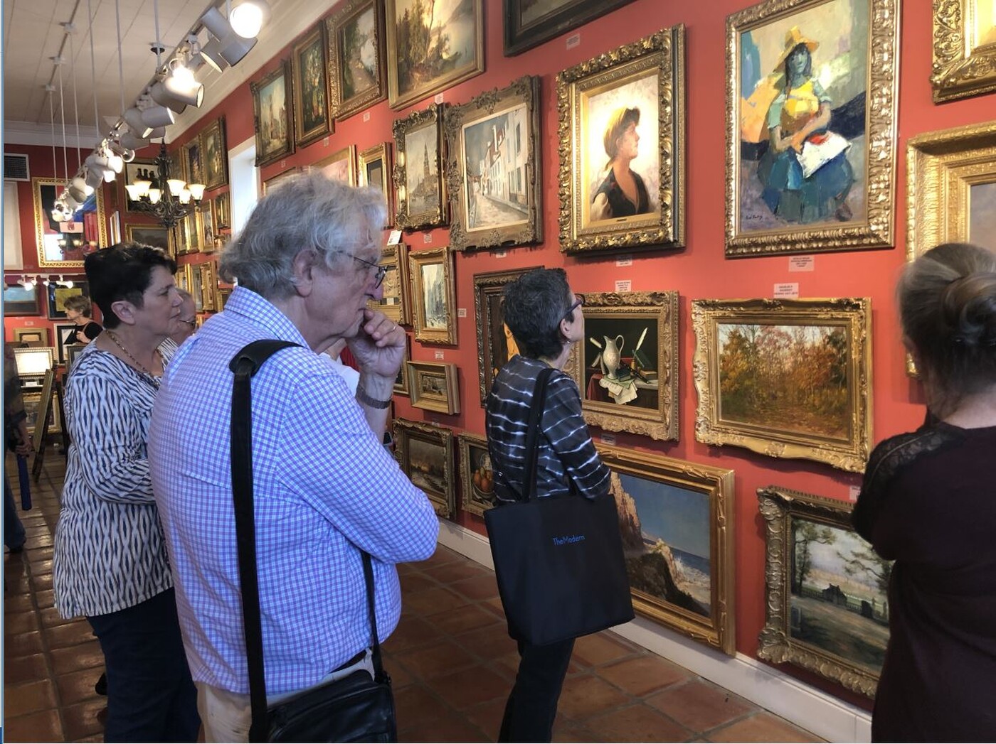 people examining a salon hang