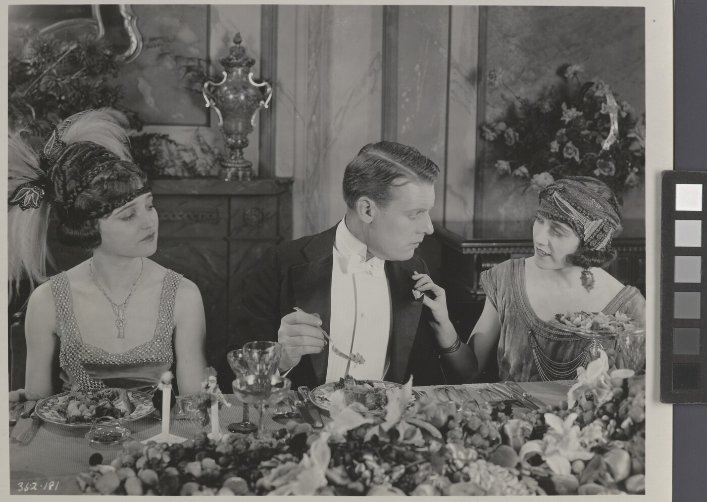 [Forrest Stanley talking to woman, Agnes Ayres looking on ...