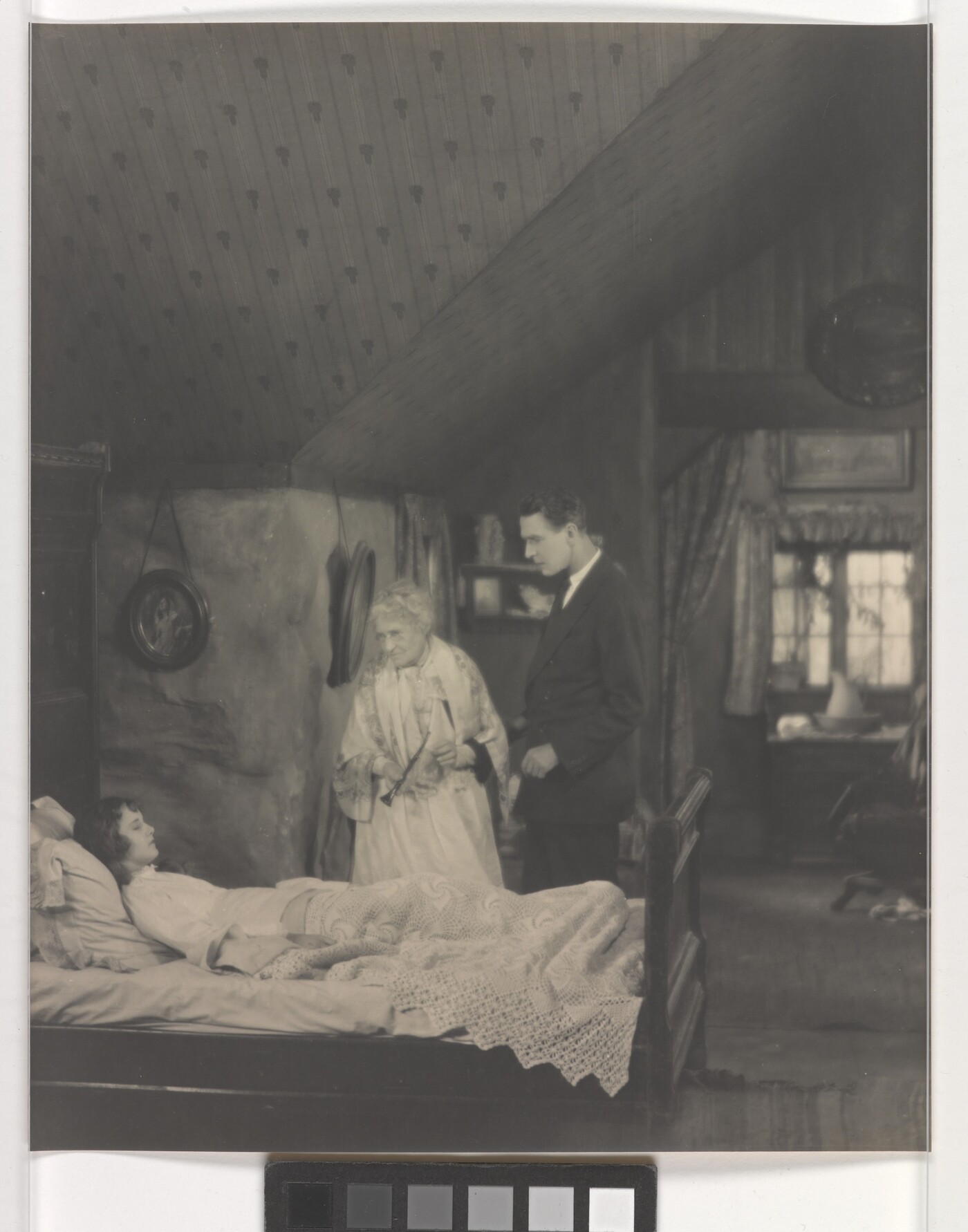 [Lucille Ricksen on deathbed, elderly woman and Percy Marmont looking