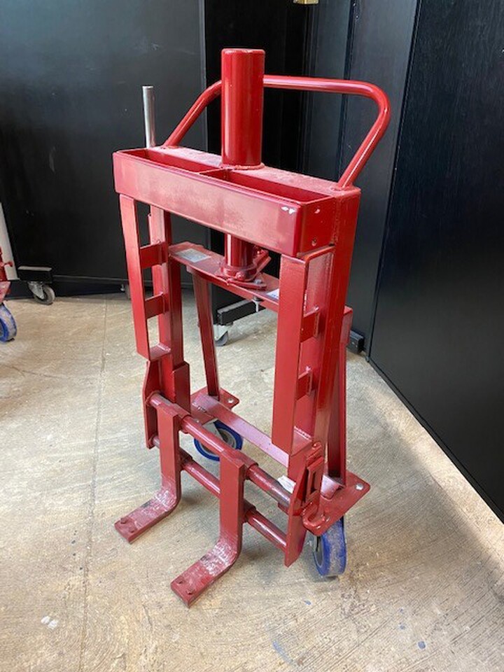 A red equipment lift with the inserts at the bottom to fit the moveable walls