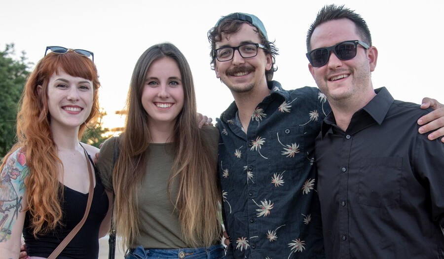 four people on the porch