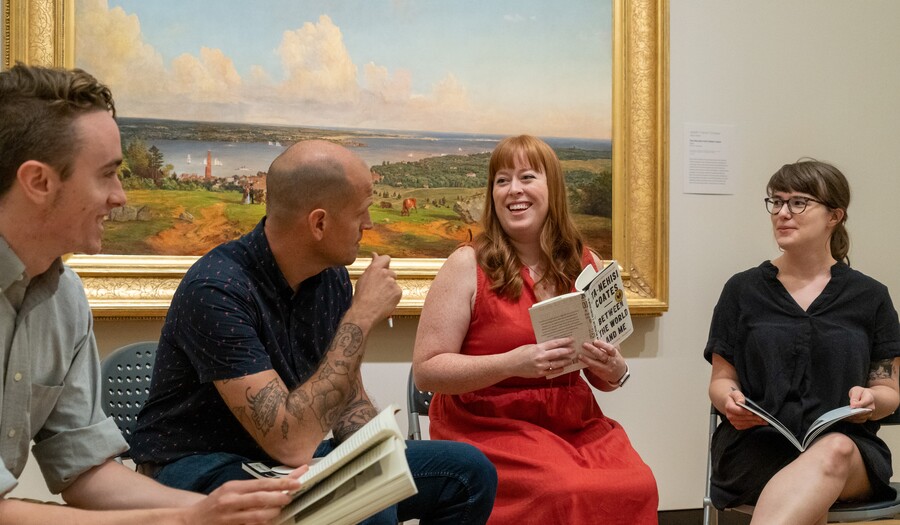 book club reading in an art gallery