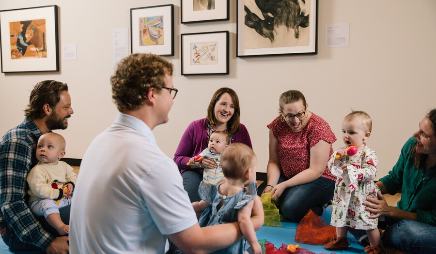 Group of babies in an art class in a gallery