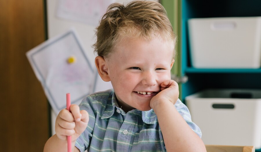 little boy coloring portraits